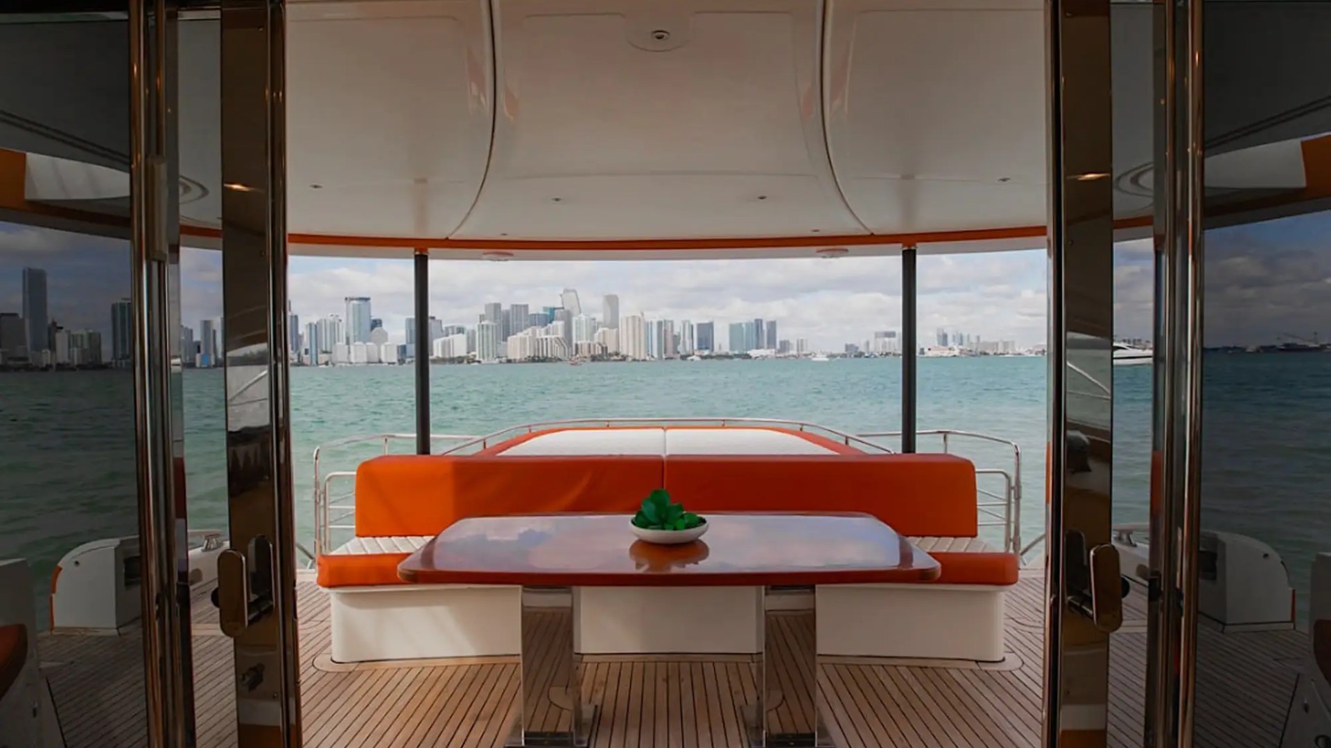 Aft deck dining setup on 62′ Powercat Miami