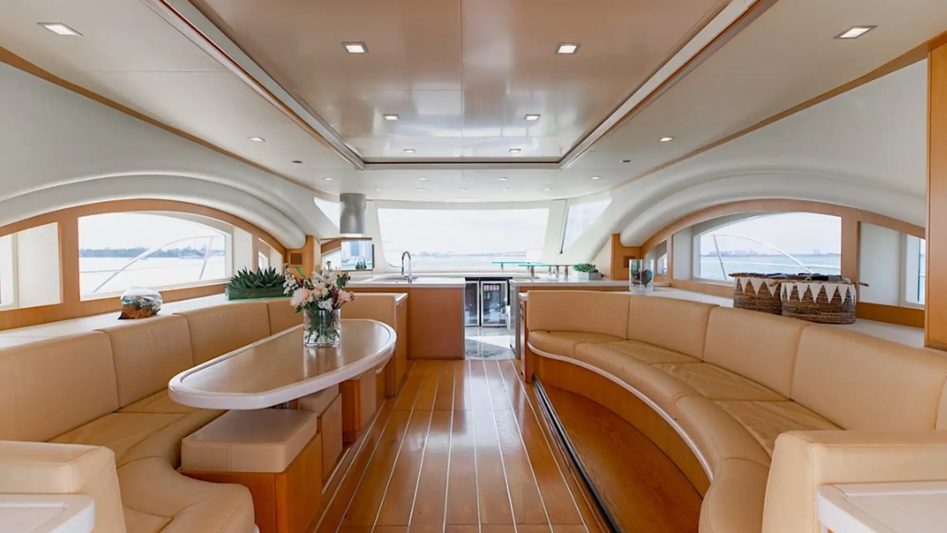 Indoor dining and salon combo on 62′ Powercat Miami
