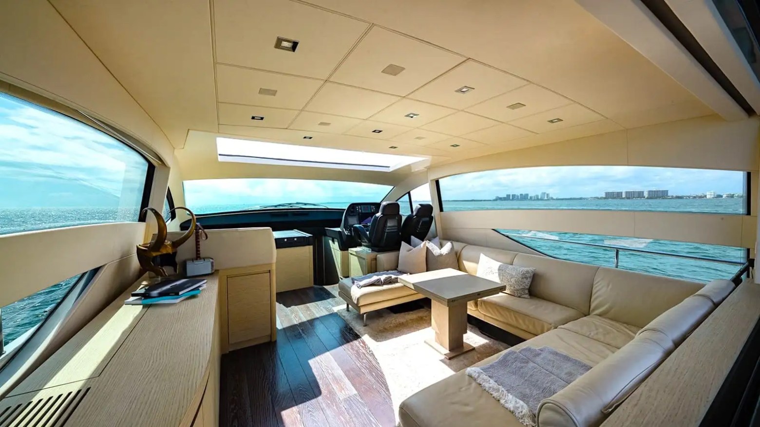Salon + dining full-view composition on 65′ Pershing Miami