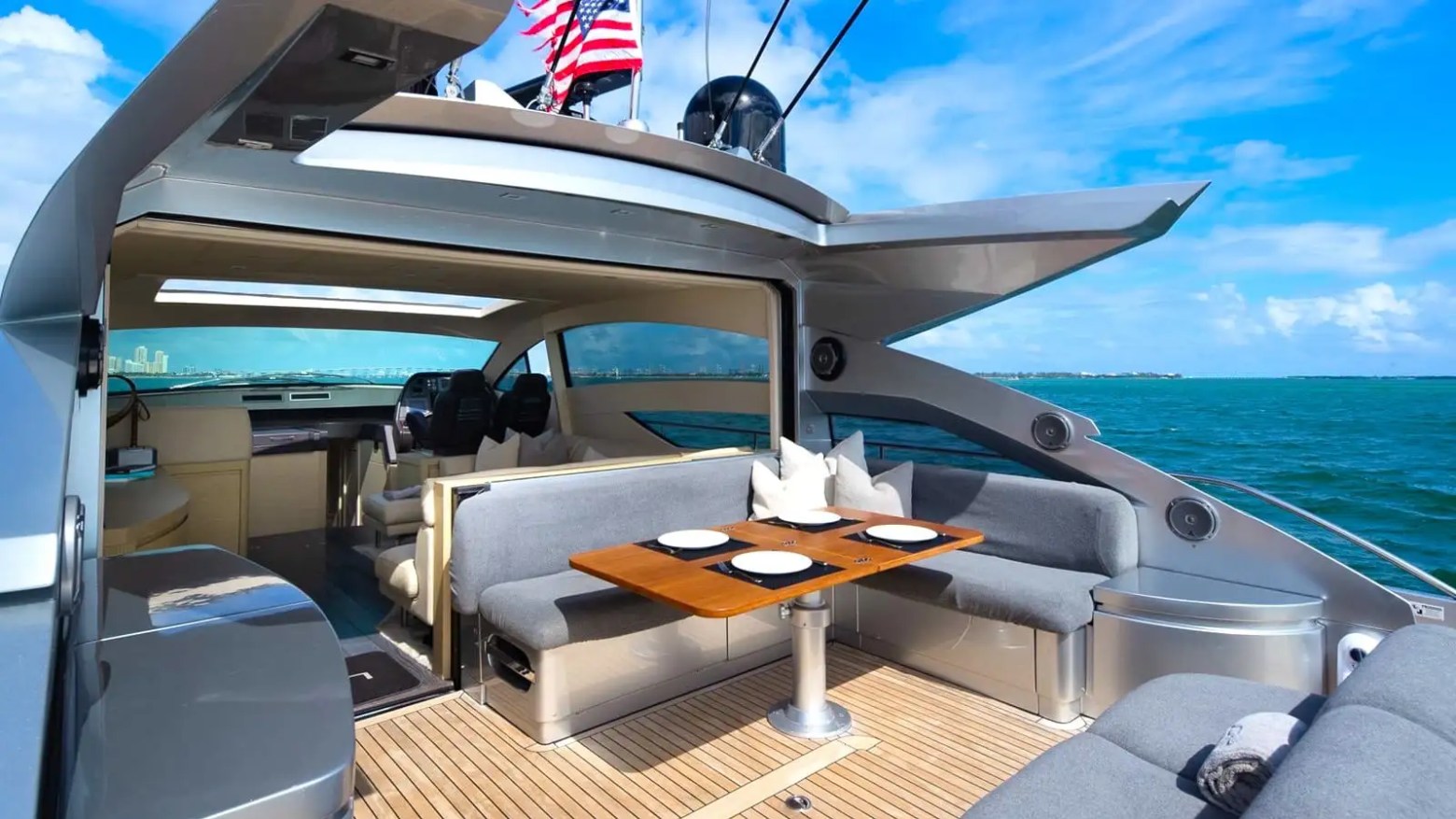Aft deck dining table on 65′ Pershing Miami
