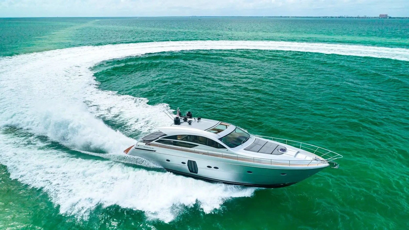 Wake trail behind yacht on 65′ Pershing Miami