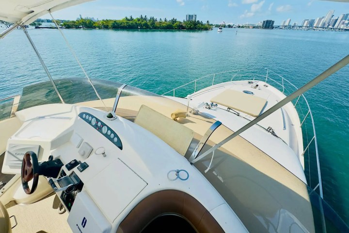 65ft Viking yacht Miami captain at exterior helm
