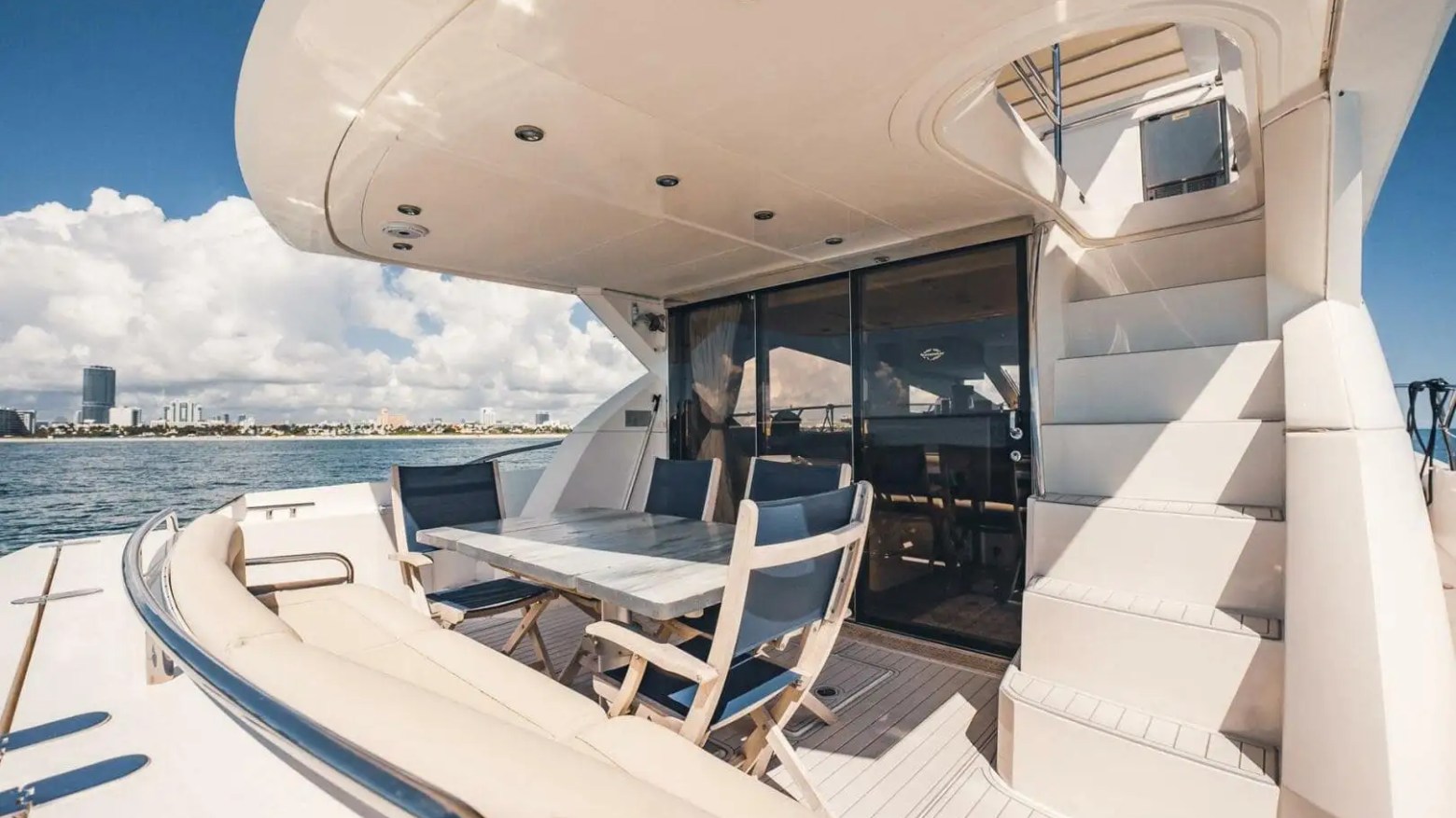 70' Sunseeker yacht charter aft deck dining area in Miami Beach on Biscayne Bay
