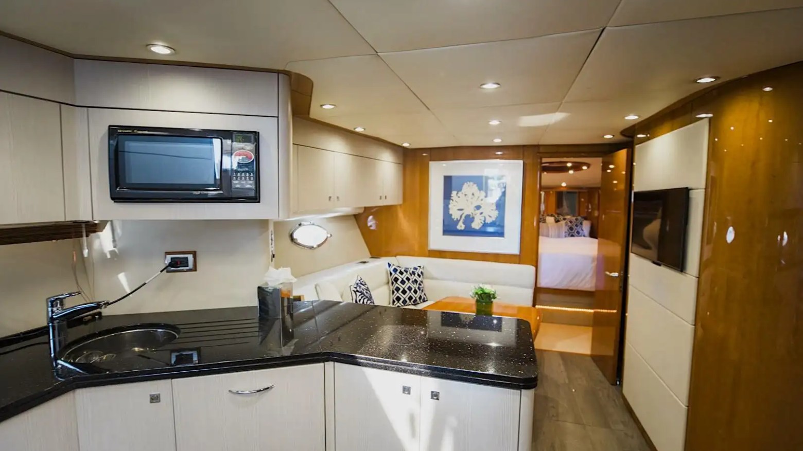 Galley + dining combined layout on 72′ Sunseeker Miami