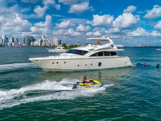 75' Aicon yacht charter cruising Miami Beach with jet ski on Biscayne Bay