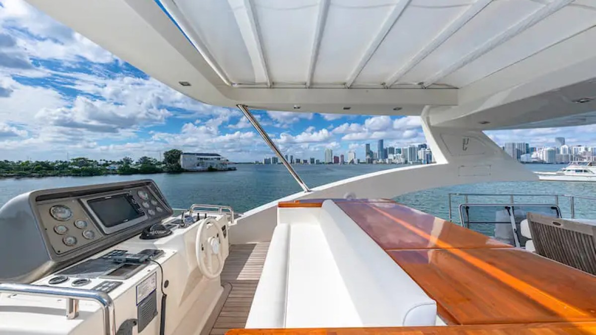 75' Aicon yacht charter flybridge helm and seating Miami Beach Biscayne Bay skyline