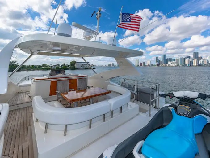 75' Aicon yacht charter aft deck seating with jet ski in Miami Beach on Biscayne Bay