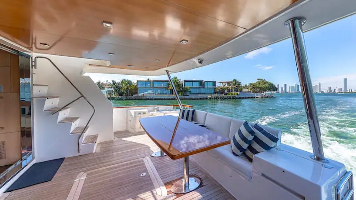 75' Aicon yacht charter aft deck dining in Miami Beach on Biscayne Bay