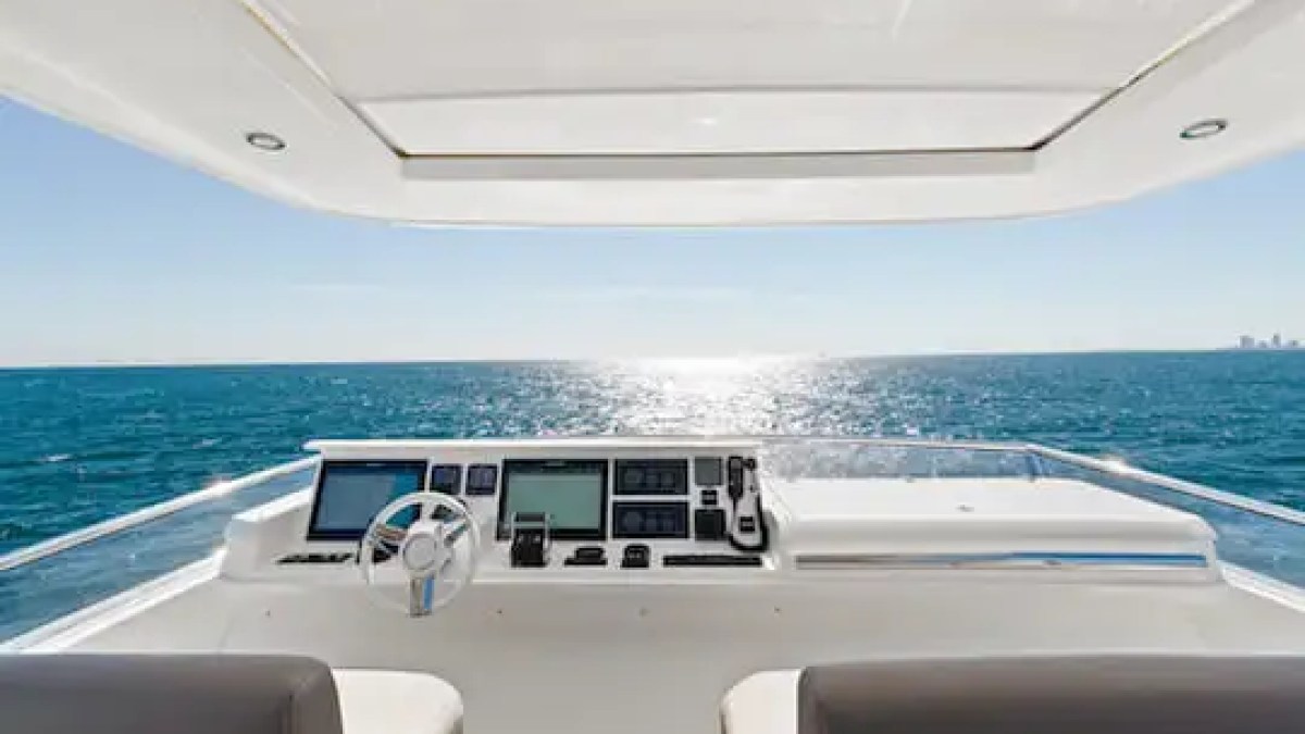 75′ Prestige yacht anchored near sandbar with guests relaxing