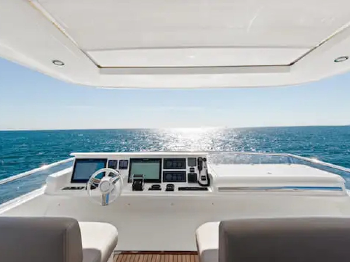 75′ Prestige yacht anchored near sandbar with guests relaxing