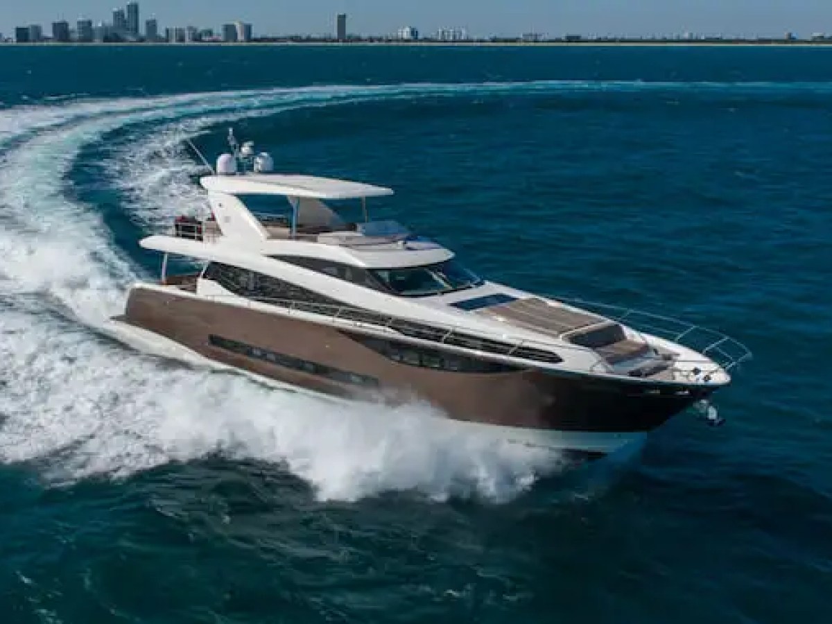 75′ Prestige yacht gliding through turquoise Biscayne Bay water