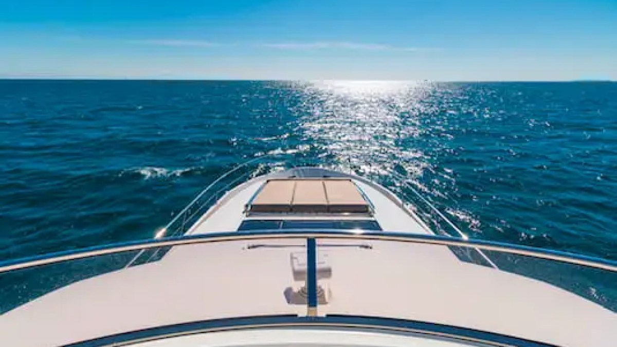 75′ Prestige yacht anchored near sandbar with guests relaxing