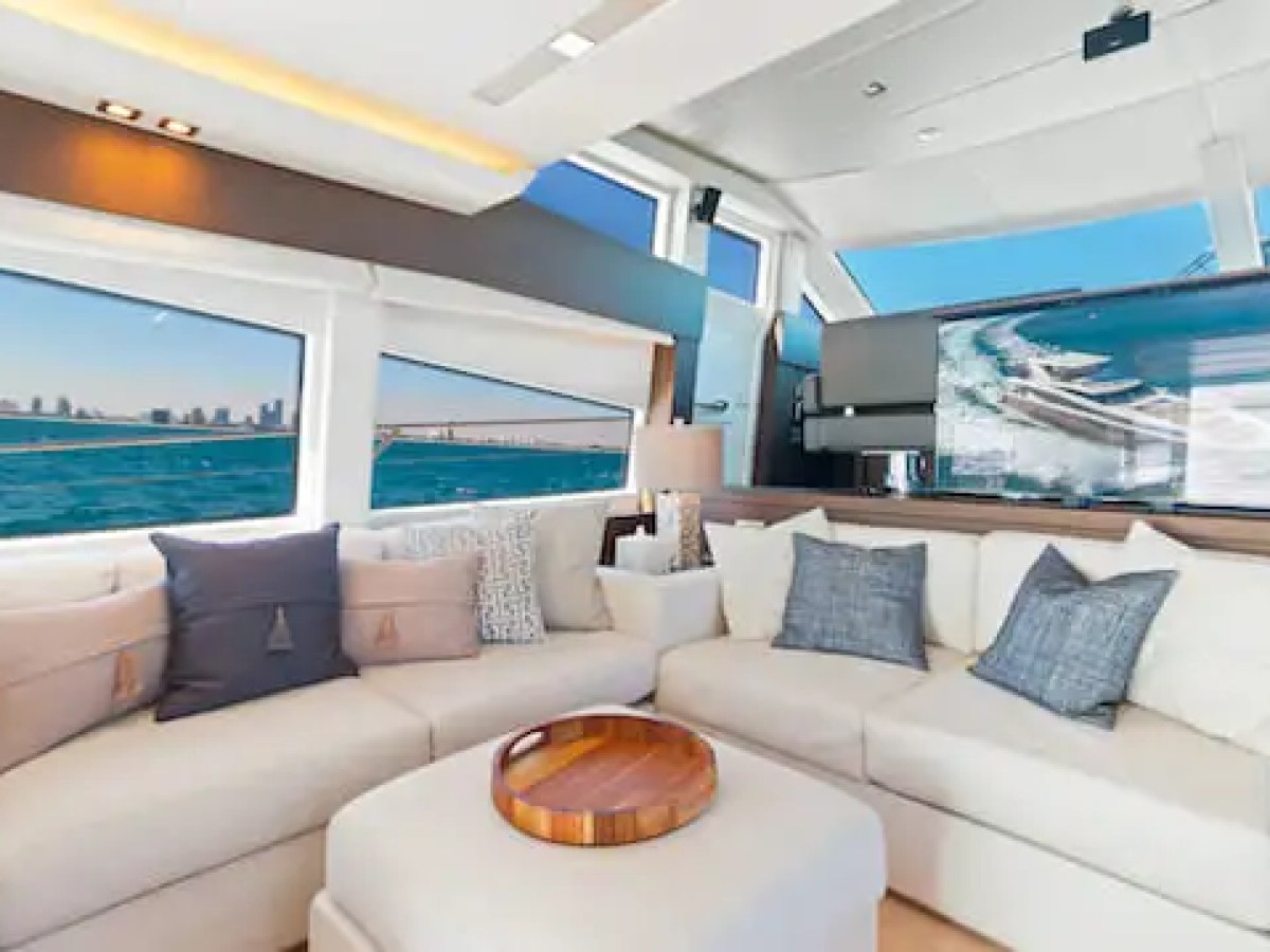 Interior lounge seating area in salon of 75′ Prestige