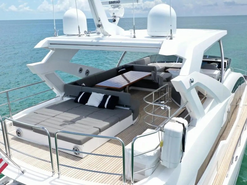 78' Sunseeker yacht charter flybridge lounge and sunbed area Miami Beach