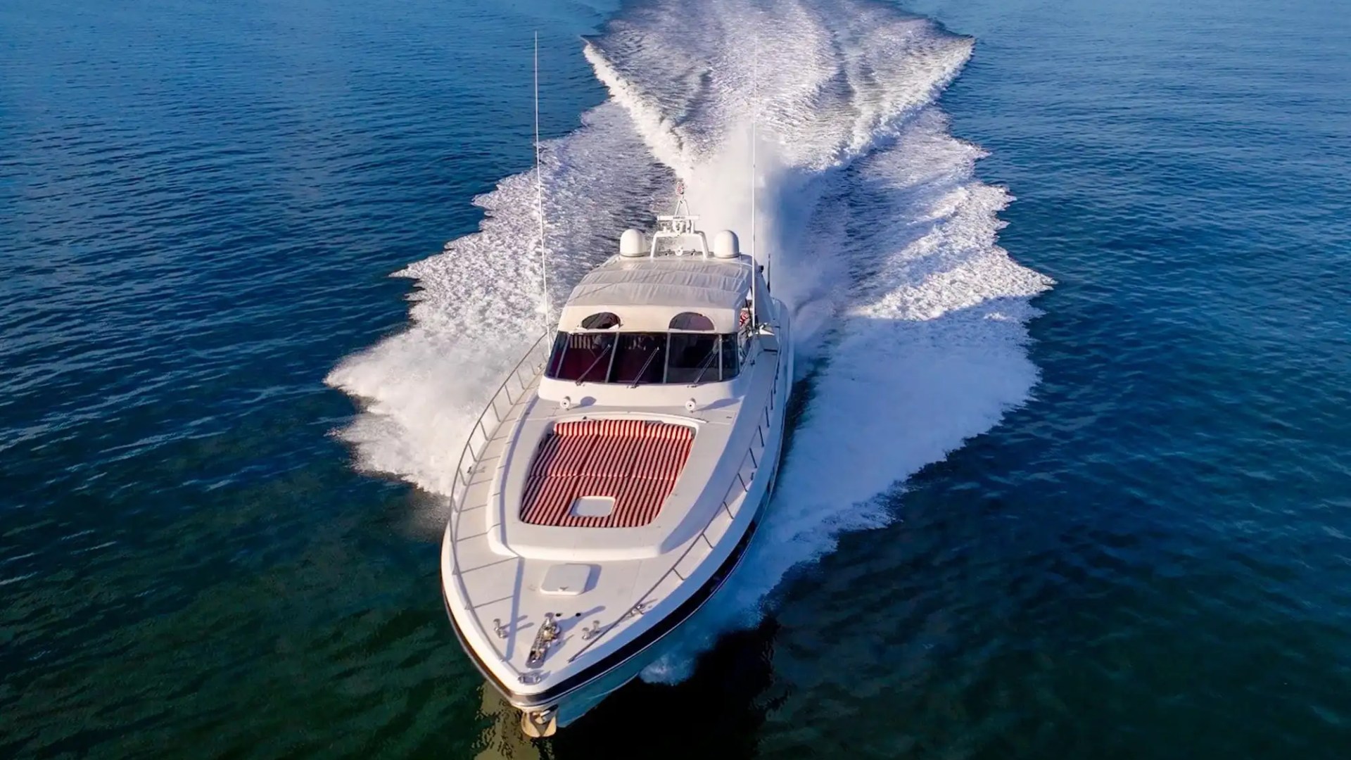 84' Mangusta yacht charter aerial speeding Miami Beach Biscayne Bay