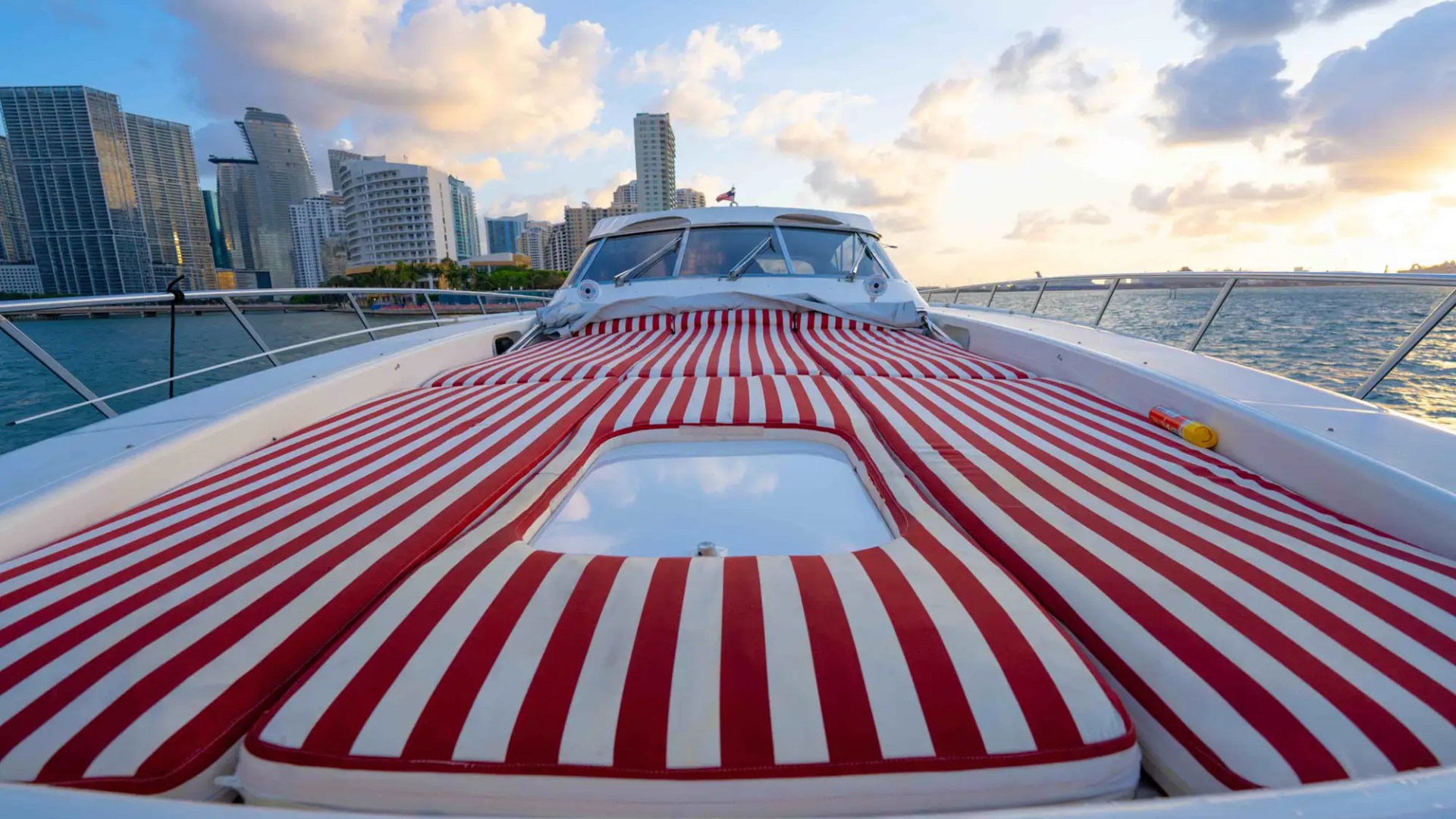 84' Mangusta yacht charter bow sunpad Miami Beach Biscayne Bay skyline view