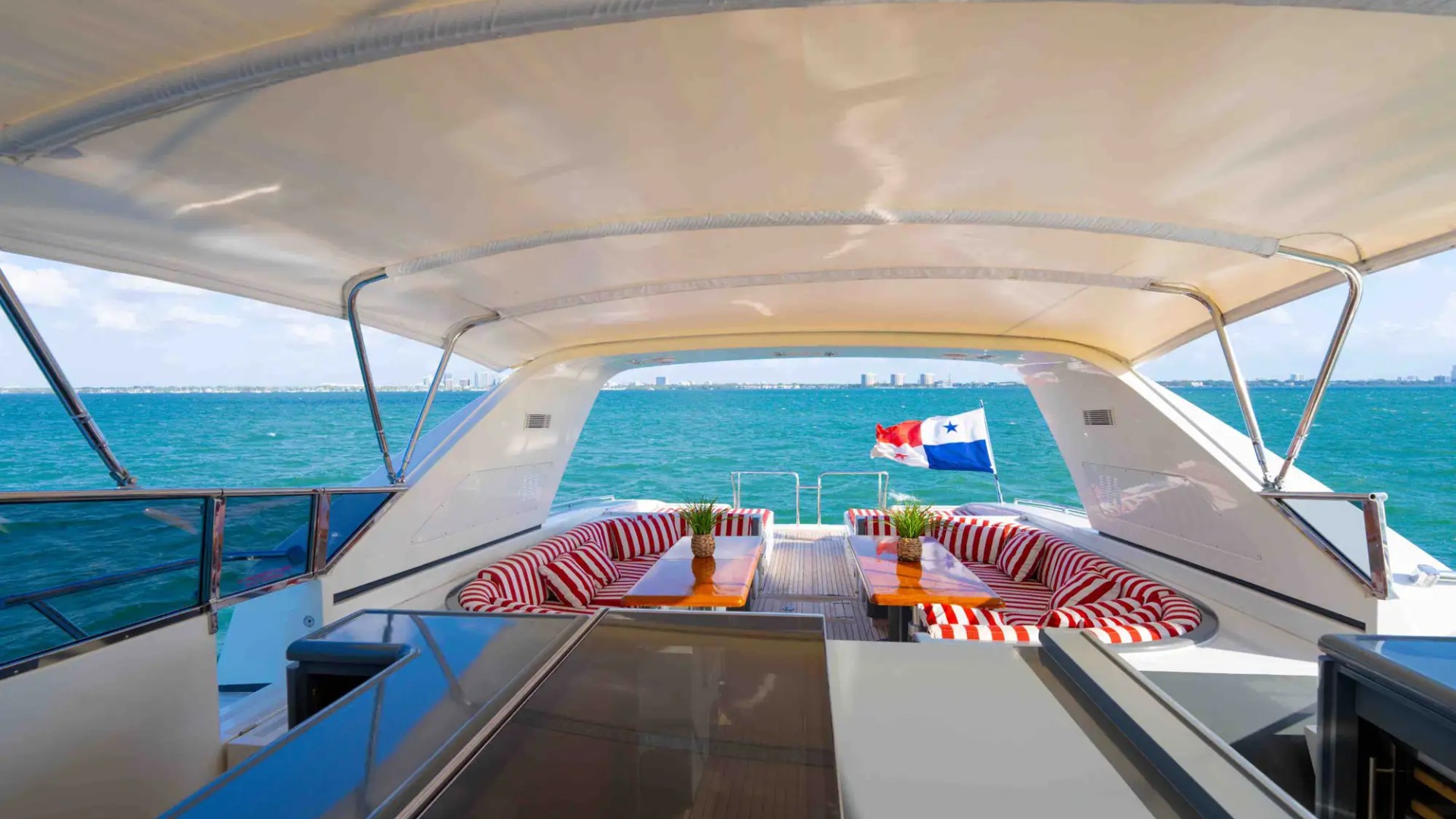 84' Mangusta yacht charter aft lounge view Miami Beach Biscayne Bay