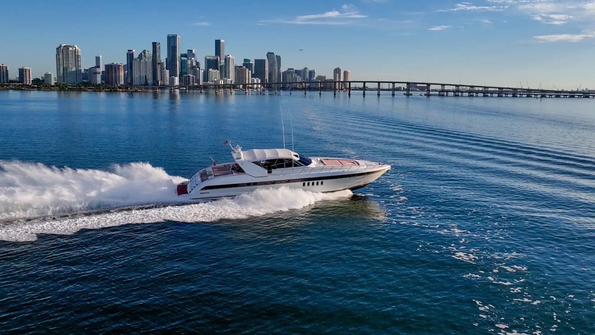 84' Mangusta yacht charter aerial cruising Miami skyline Biscayne Bay