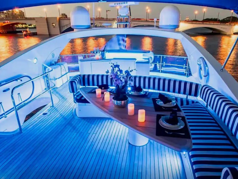 84' Sunseeker yacht charter flybridge lounge at night Miami Beach