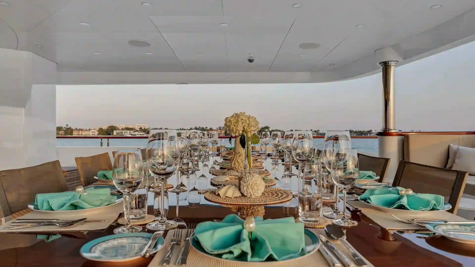Aft-deck alfresco dining on 166′ Trinity Miami