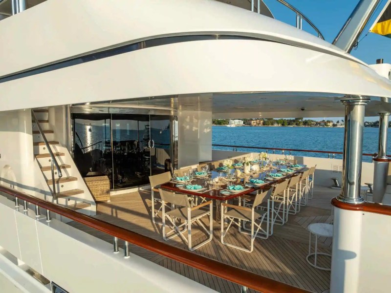 Aft-deck alfresco dining on 166′ Trinity Miami