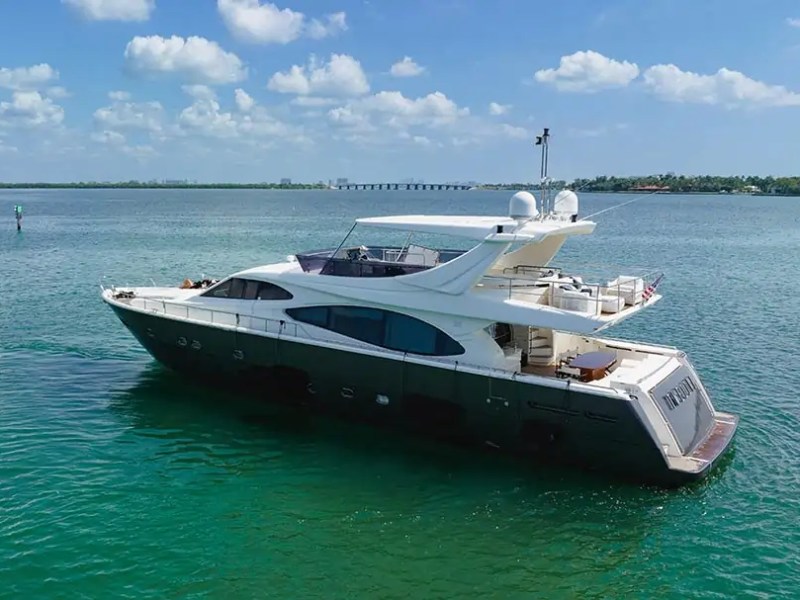 78' Ferretti yacht charter anchored in turquoise waters near Miami Beach