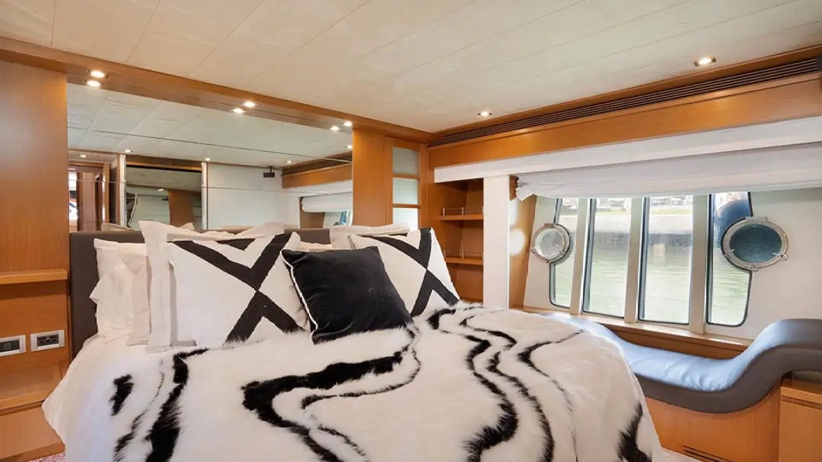 78' Ferretti yacht charter luxury master stateroom with waterfront windows in Miami Beach