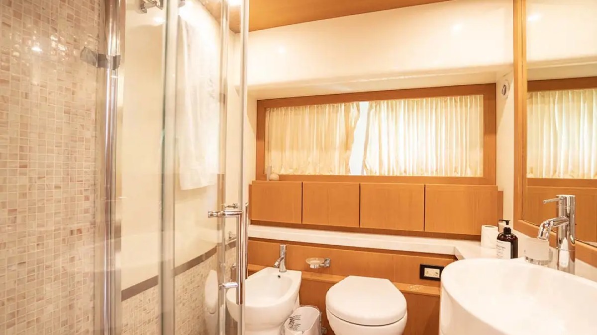78' Ferretti yacht charter guest bathroom with glass shower in Miami Beach