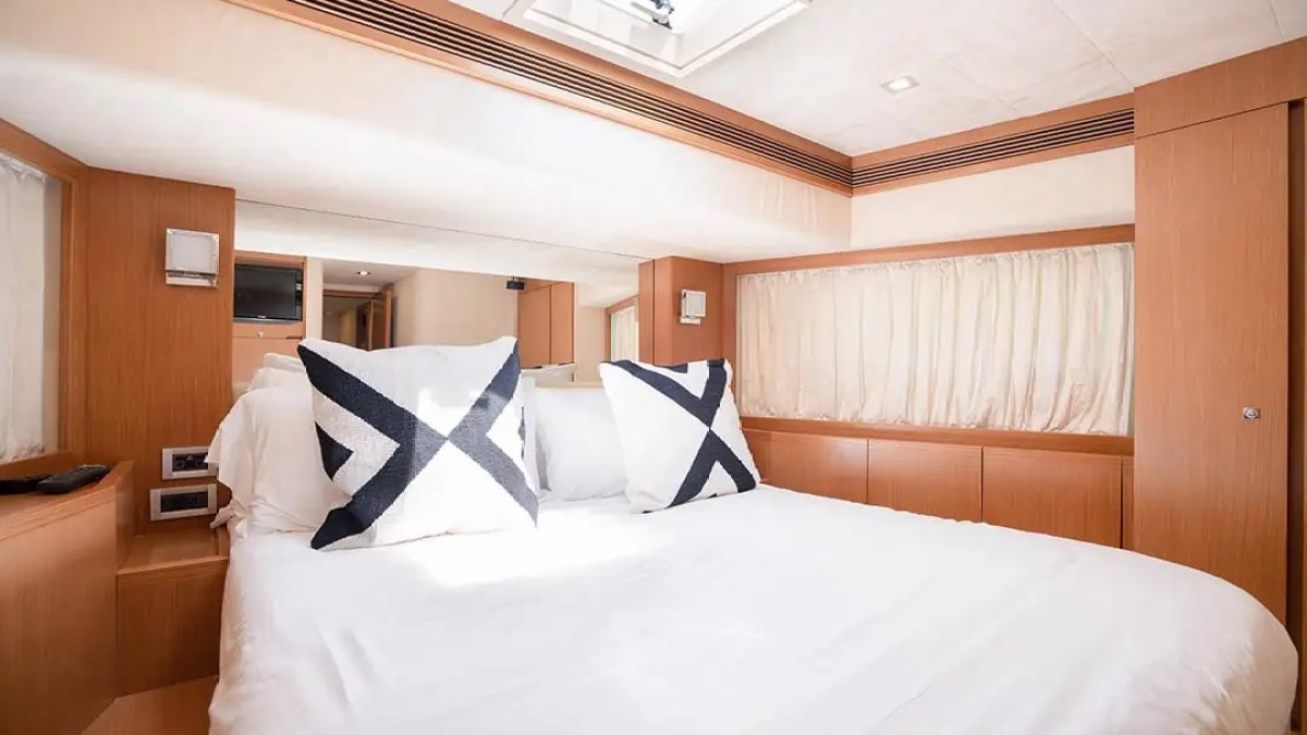 78' Ferretti yacht charter guest stateroom interior with skylight in Miami Beach