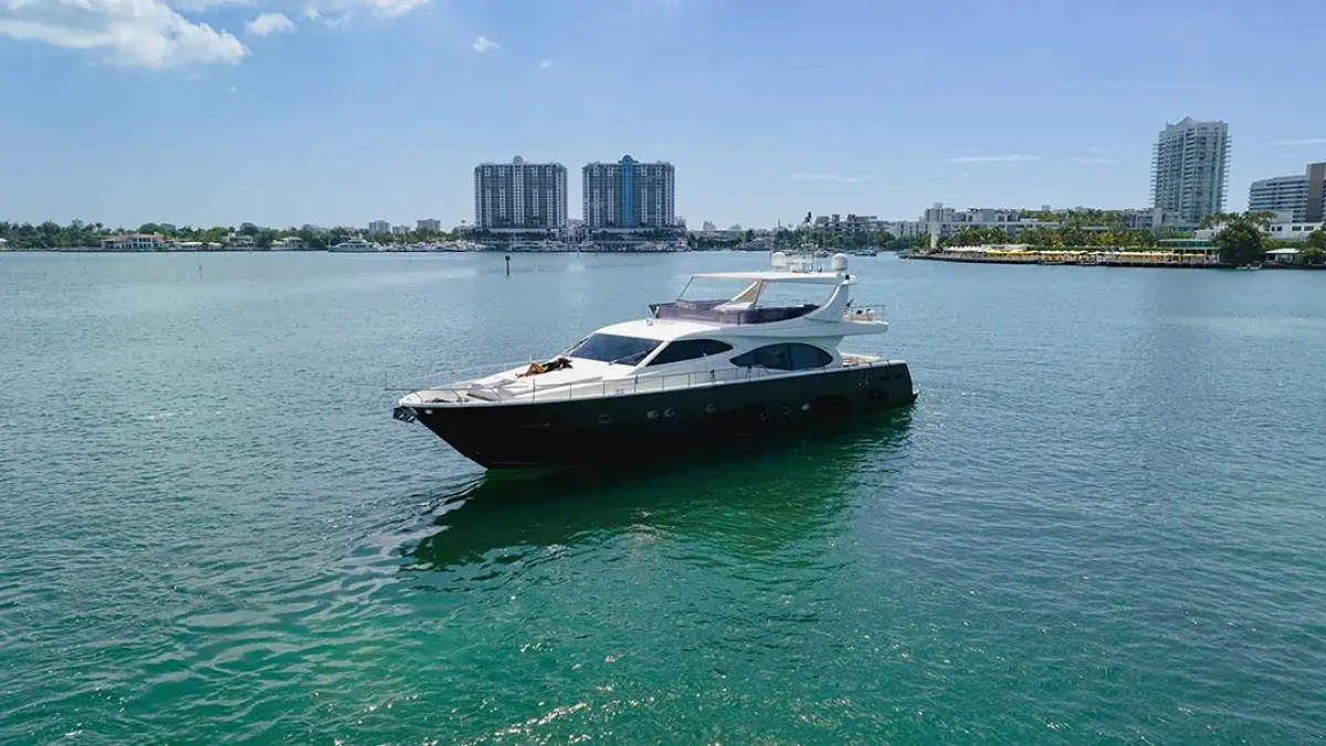 78' Ferretti yacht charter cruising Miami Beach in Biscayne Bay aerial view