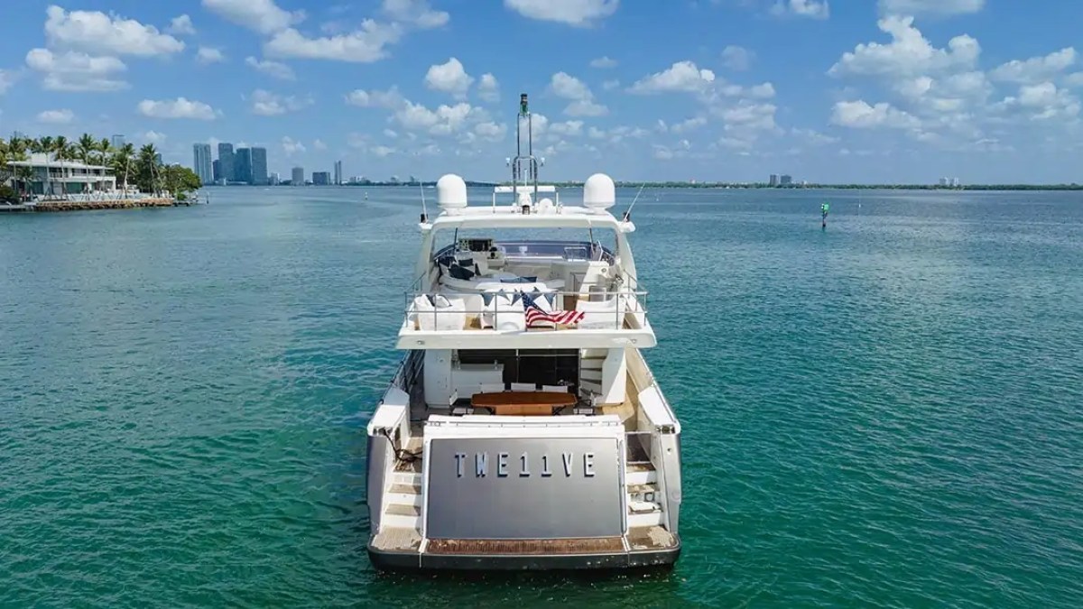 78' Ferretti yacht charter stern view anchored in Biscayne Bay near Miami Beach