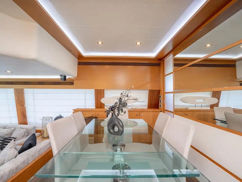 78' Ferretti yacht charter interior dining table with modern decor in Miami Beach