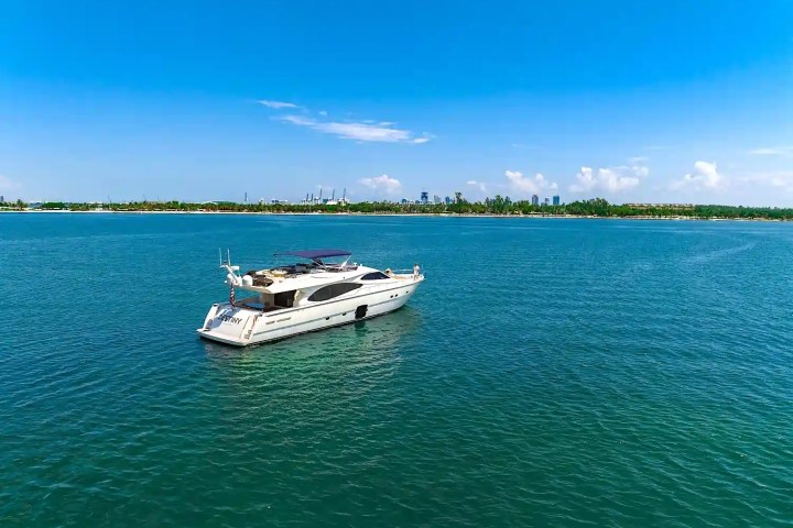 Aerial cruising pass of 80′ Ferretti Miami