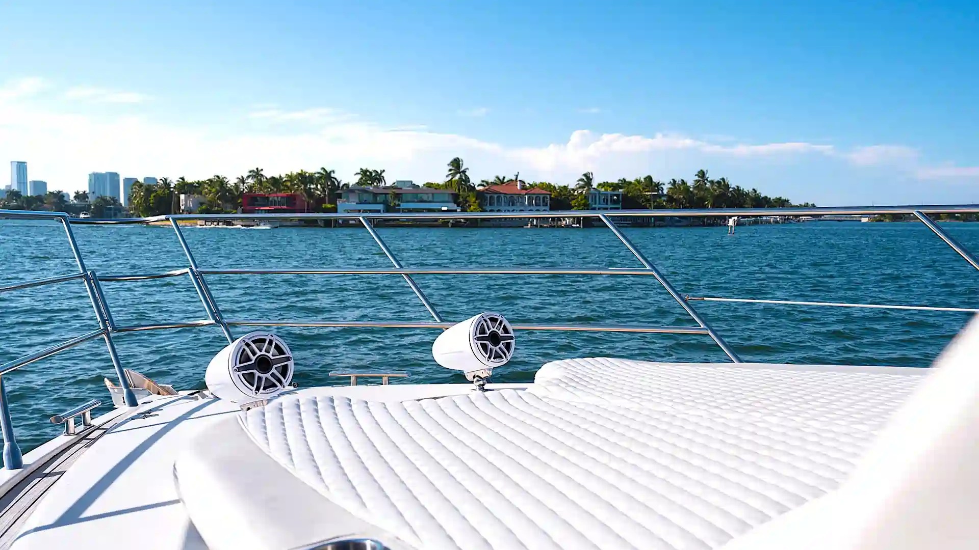 Deck seating area with skyline views aboard 65′ Azimut yacht