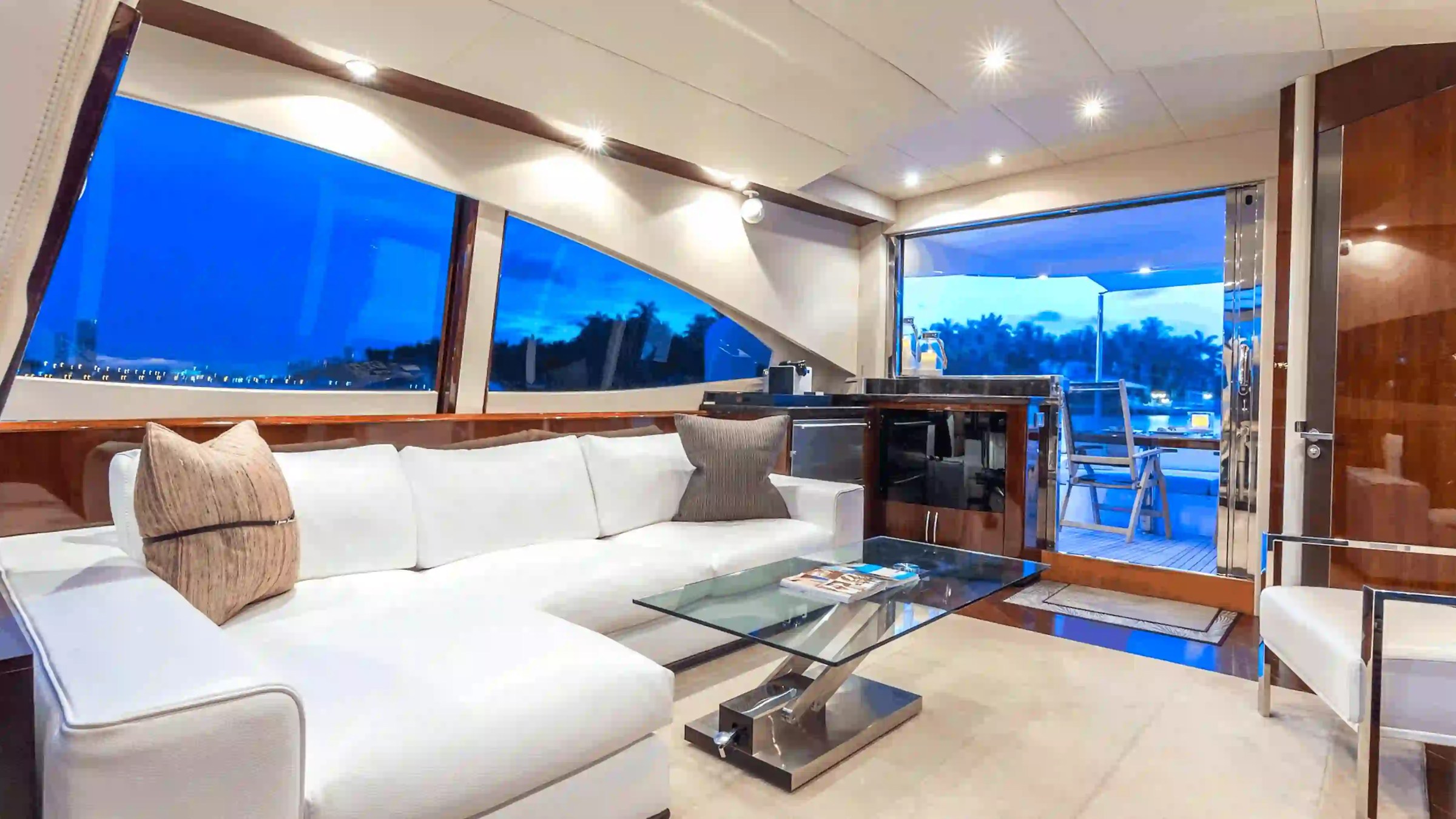 75' Lazzara yacht charter luxury salon interior seating area in Miami Beach