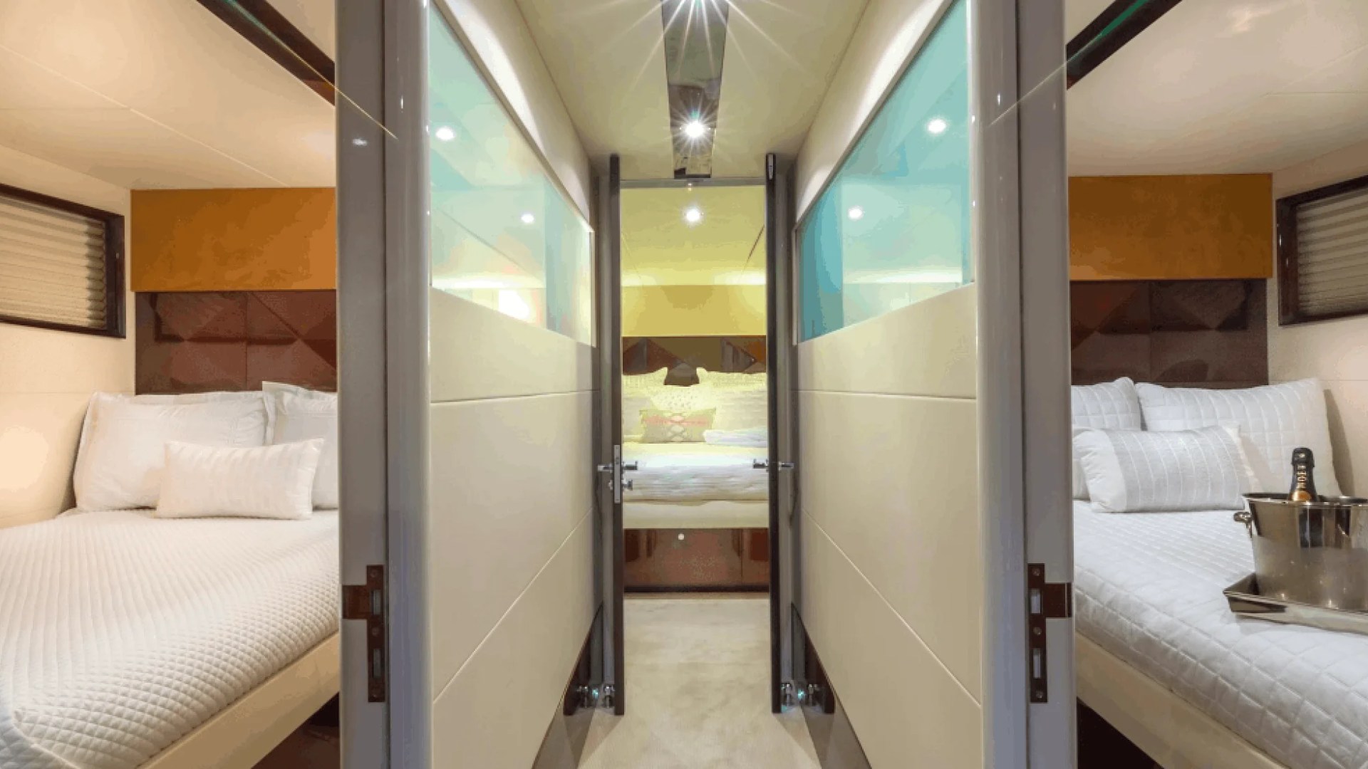 75' Lazzara yacht charter guest stateroom hallway with twin cabins in Miami Beach