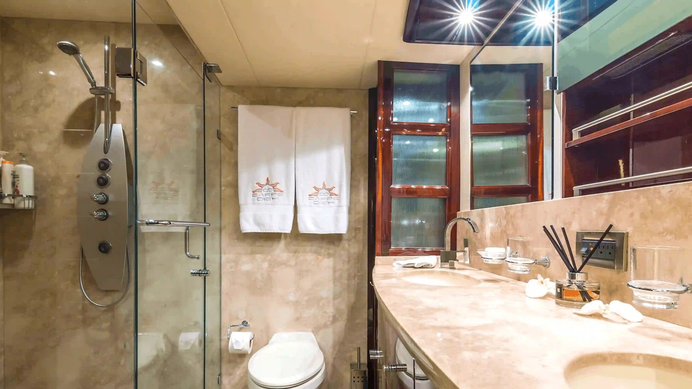 75' Lazzara yacht charter guest bathroom with glass shower in Miami Beach