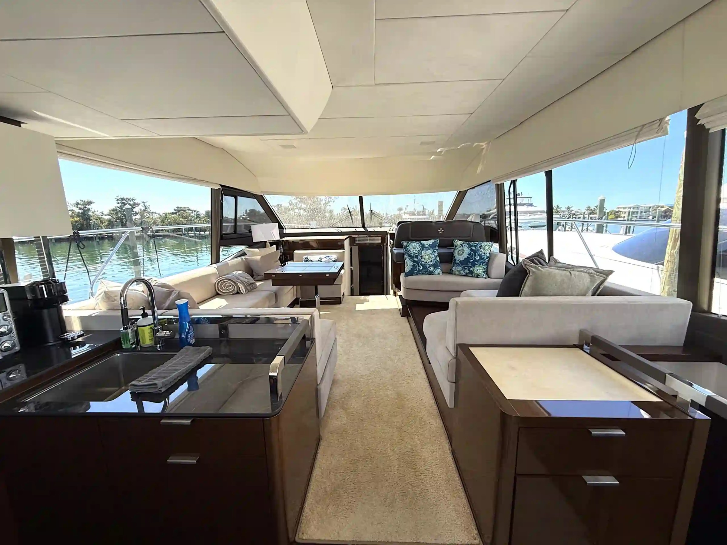 Prestige 59 yacht charter Anna Maria salon interior seating and galley view