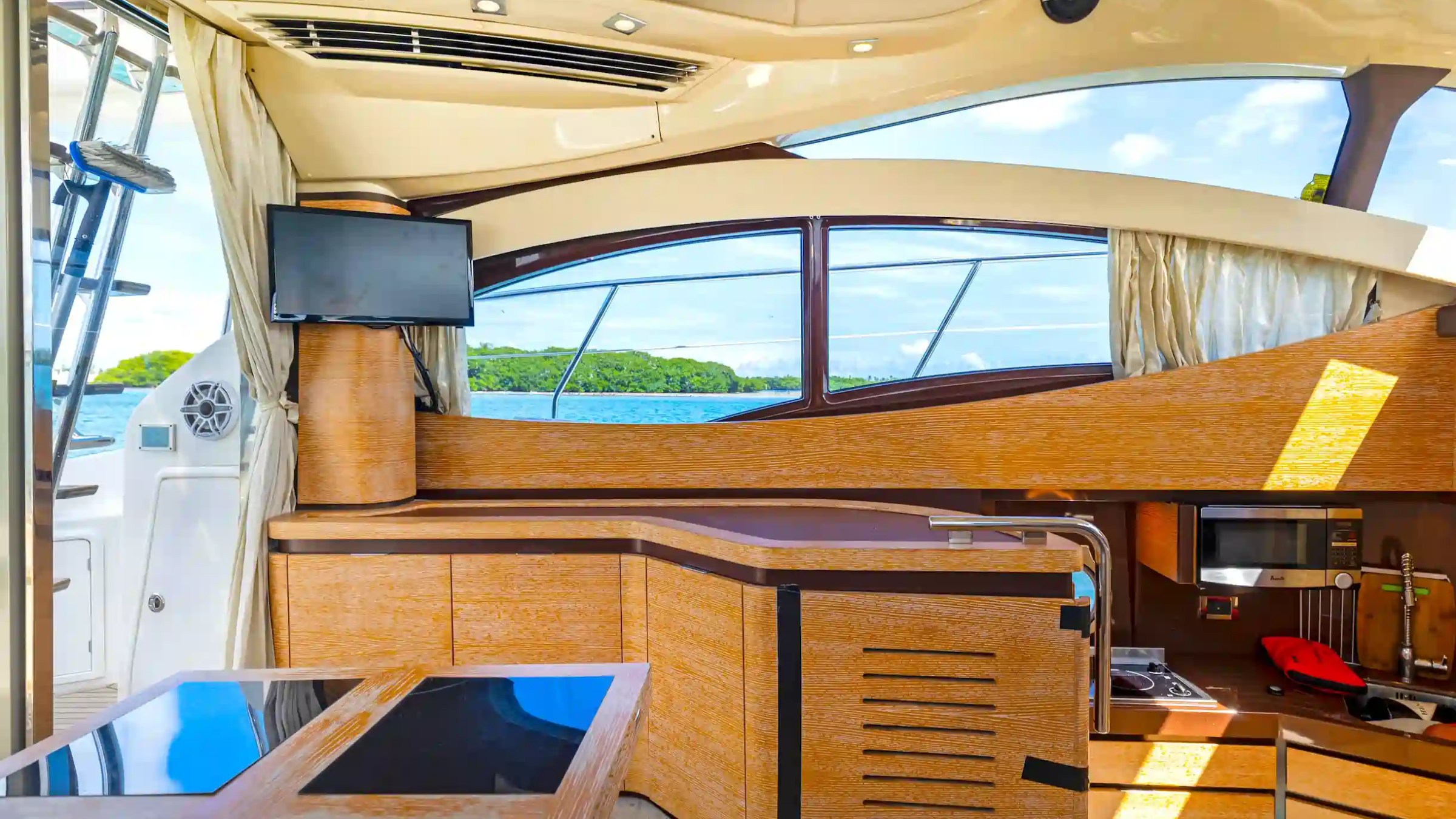45' Azimut boat rental Miami salon interior galley and TV window view