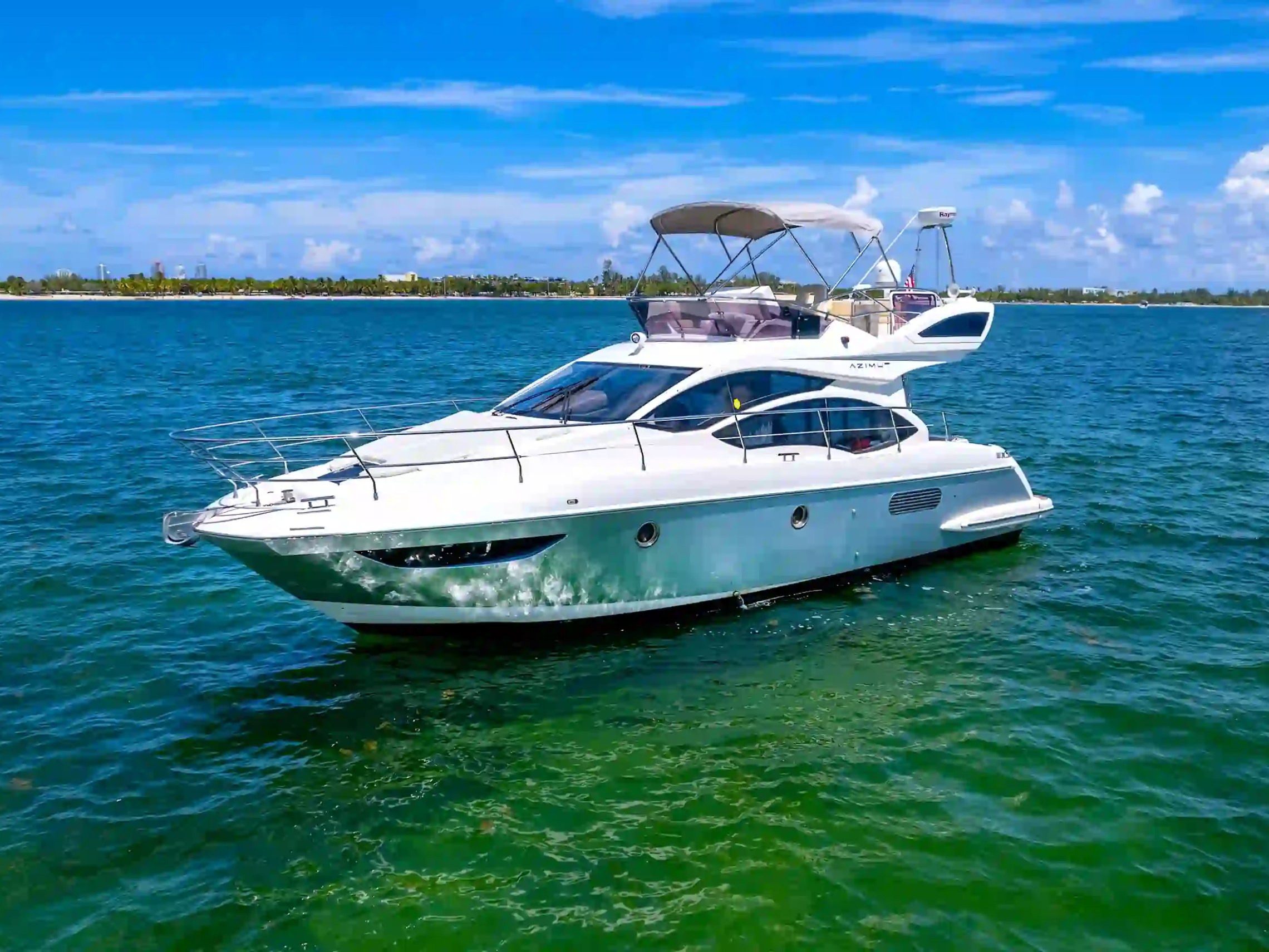 45' Azimut boat rental Miami profile cruising Biscayne Bay clear water view