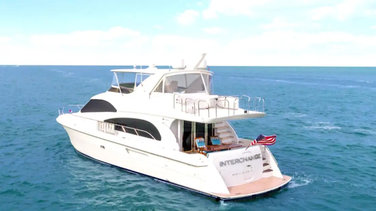 64' Hatteras Yacht Charter captured from a bird's-eye perspective showcasing the yacht underway with expansive aft decks, flybridge, and open Gulf of America waters near Marco Island.