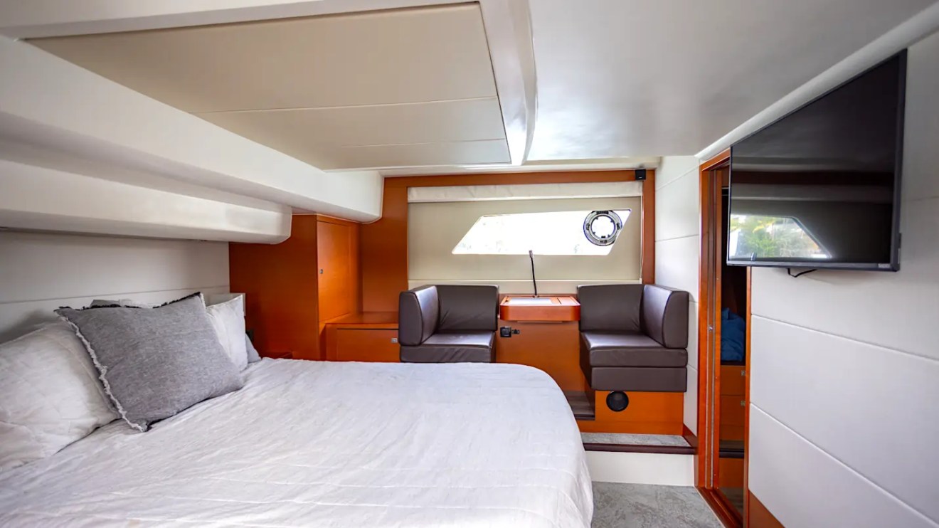 58' Prestige Yacht Charter full-beam master stateroom with king berth, private lounge, and luxurious accommodations cruising Miami and Biscayne Bay.
