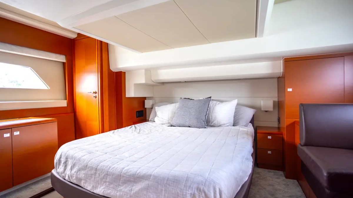 58' Prestige Yacht Charter VIP guest stateroom with queen berth, contemporary furnishings, and luxurious overnight accommodations in Miami.
