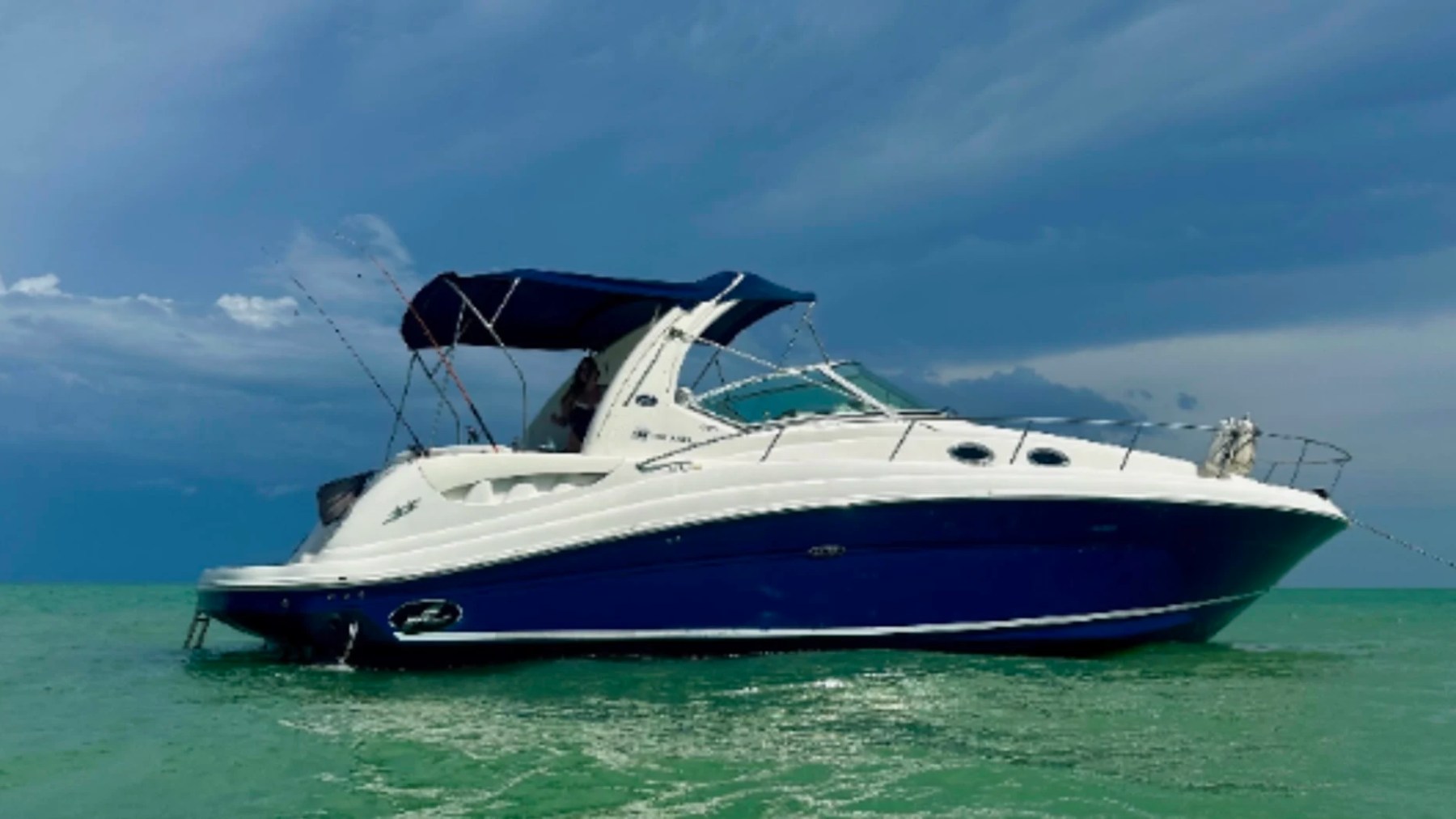 37' SeaRay Boat Rental anchored in the Gulf waters near Cape Coral.
