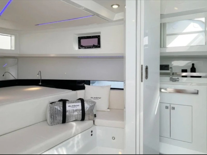 36' De Antonio Boat Rental private forward cabin with convertible berth in Delray Beach.
