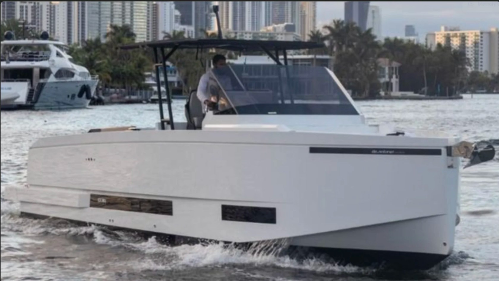 36' De Antonio Boat Rental cruising offshore near Delray Beach with sleek European styling.