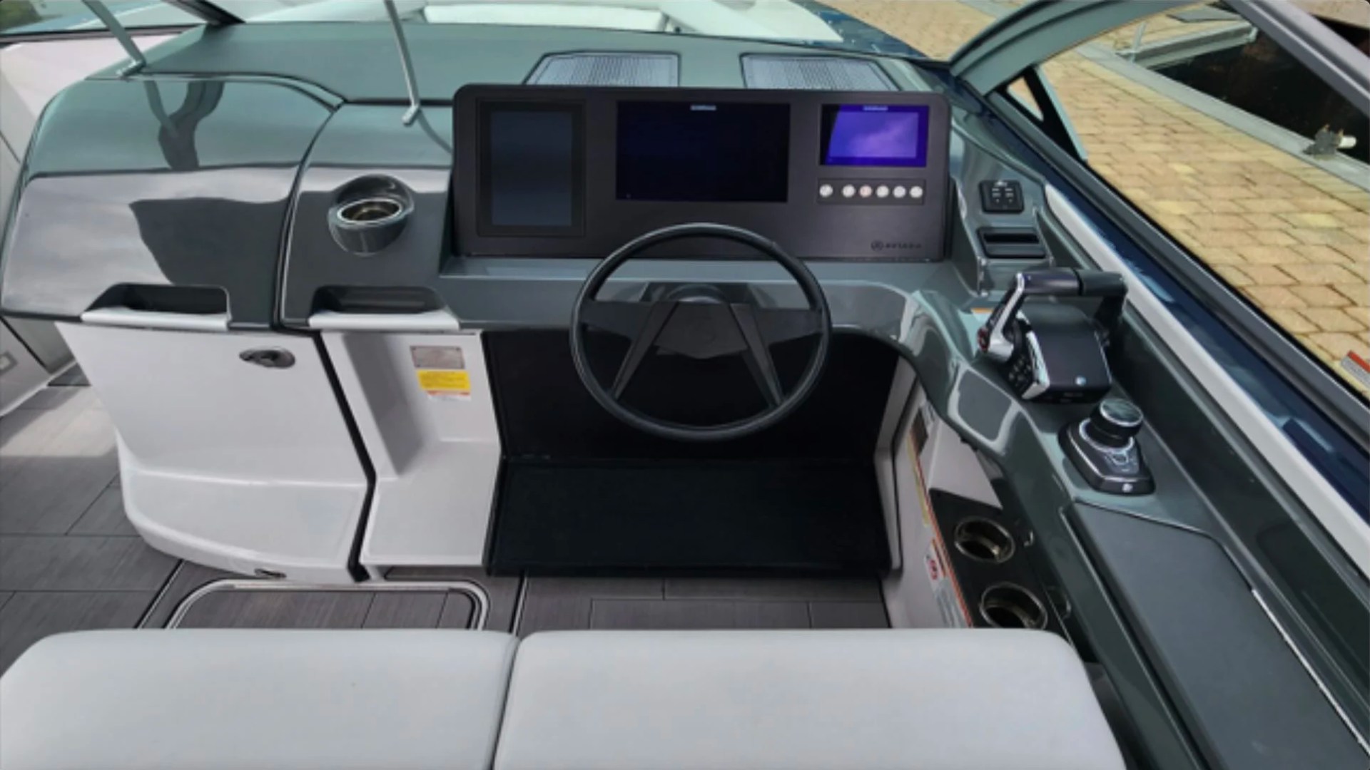 32' Aviara Yacht Charter helm station with digital navigation controls in Fort Myers.