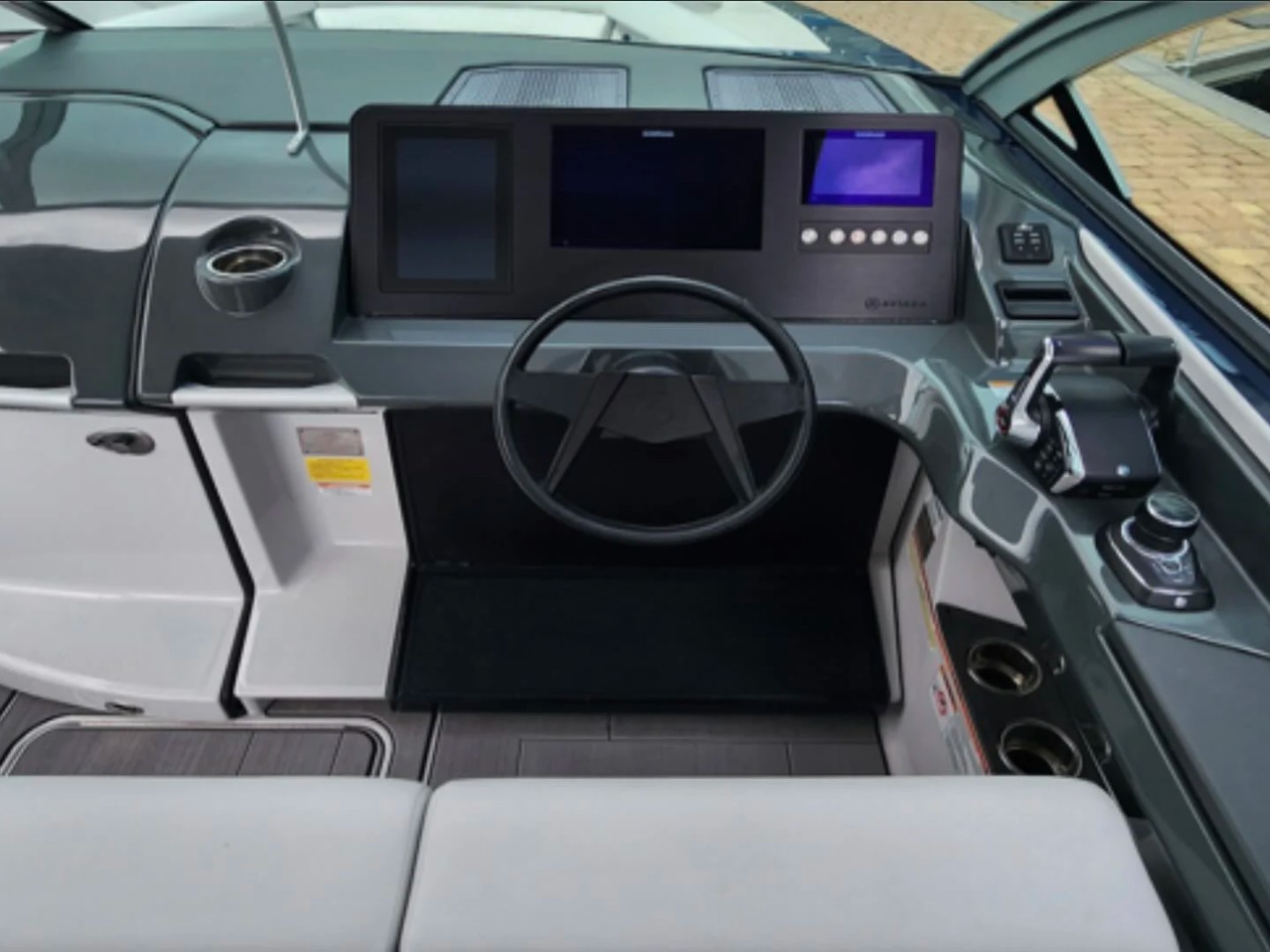32' Aviara Yacht Charter helm station with digital navigation controls in Fort Myers.