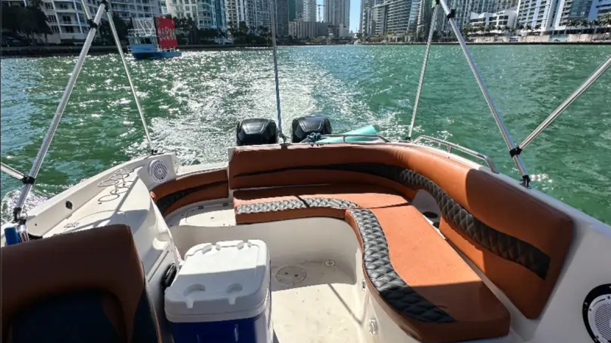 Spacious aft lounge aboard a 30' Hurricane Boat Rental cruising through Downtown Miami on Biscayne Bay.