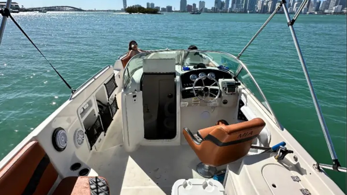 Helm and cockpit aboard a 30' Hurricane Boat Rental cruising Biscayne Bay in Miami.